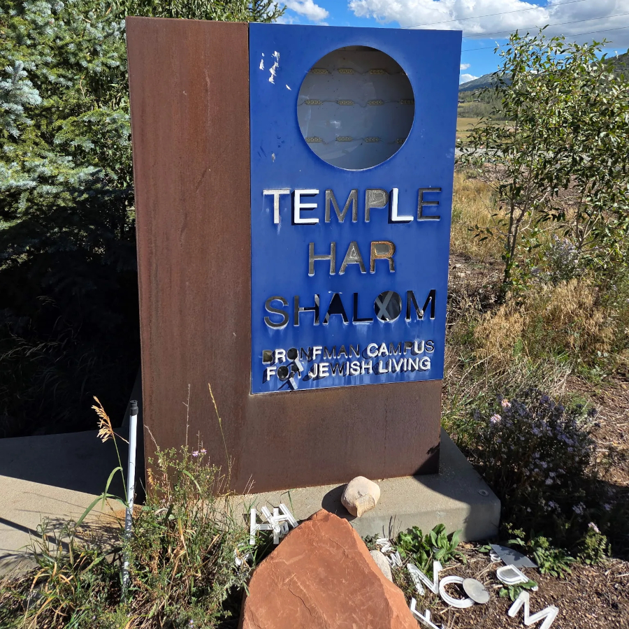 Damaged sign with the letters scattered on the ground
