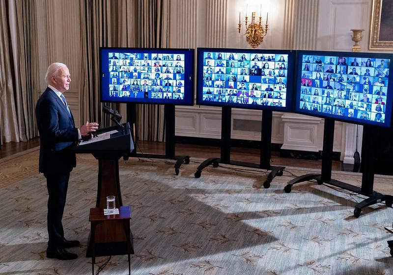 President Joe Biden addresses a Zoom teleconference.